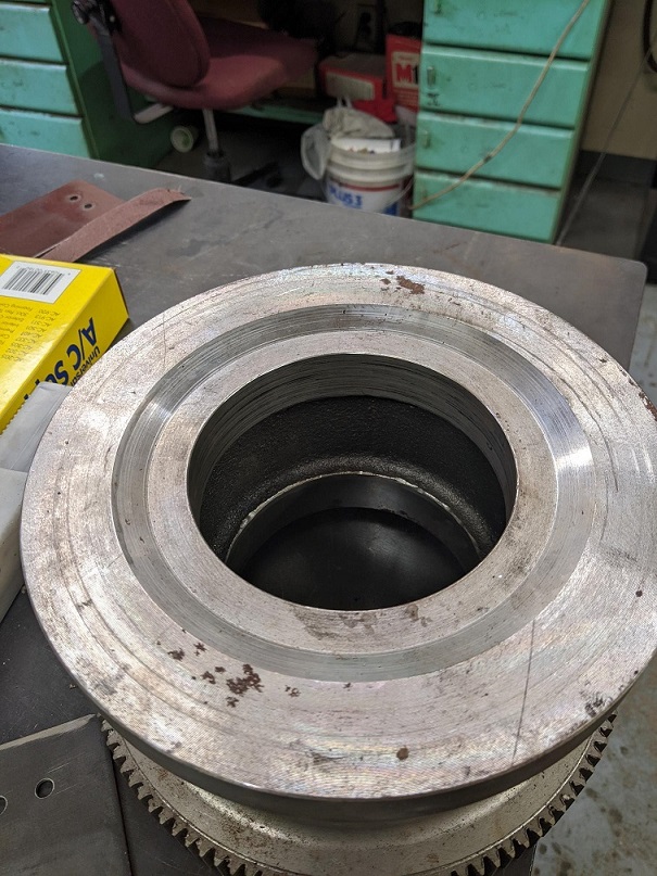 If you look at the photograph I have attached of one of our spare Geared Wheels you will see there is also an indention in the wheel.  This is 7mm deep by 171.45mm wide.  This is also on both sides of the wheel.jpg